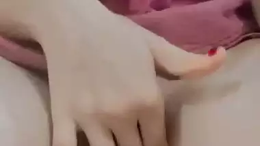 Nude Bhabhi presses boobs and fingers her pussy