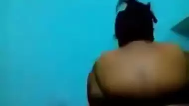 Mature Desi in a red sari exposes her big sex parts in a XXX show