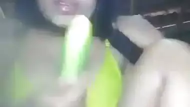 Naked Assamese girl fucks her pussy with a cucumber