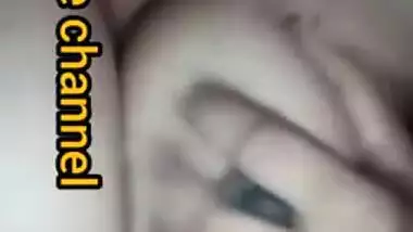 Naughty Desi woman squeezes tits to lick nipples in the porn video