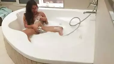 I catch my Indian girlfriend masturbating with a hand shower and join in